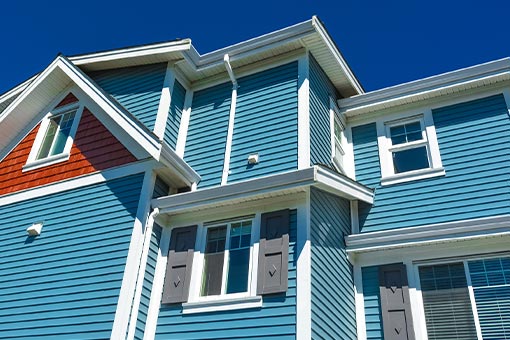 back of townhouses blue siding