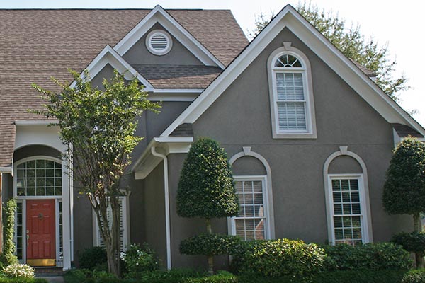 modern home with dark stucco face